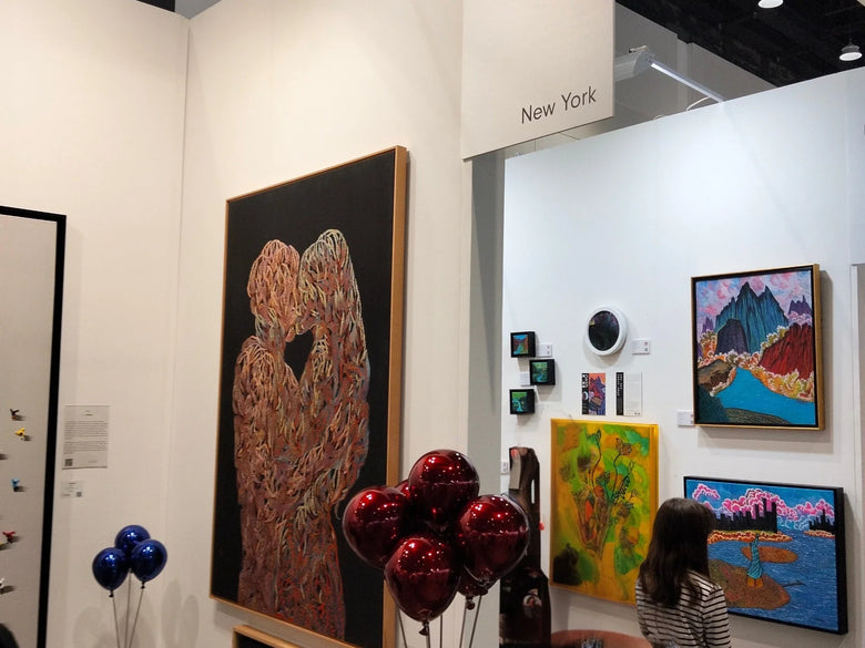 Curated contemporary fine art collection by Senja Living Art Gallery.: Paintings and sculptural art objects at an exhibition.