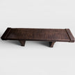 Hand-carved solid mango wood bench featuring a dark charred espresso finish and deep ridged sculptural textures.