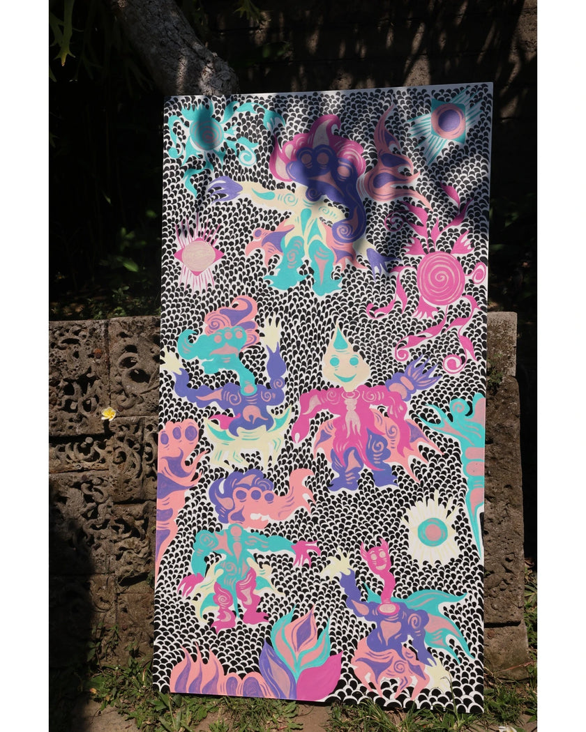 Keep Smiling (2026), an original painting by emerging Balinese artist I Made Ananda Krisna, displayed outdoors against a stone wall carved by artist I Nyoman Bratayasa on their family’s art gallery property in Bali, surrounded by lush tropical foliage — curated and photographed by Senja Living.