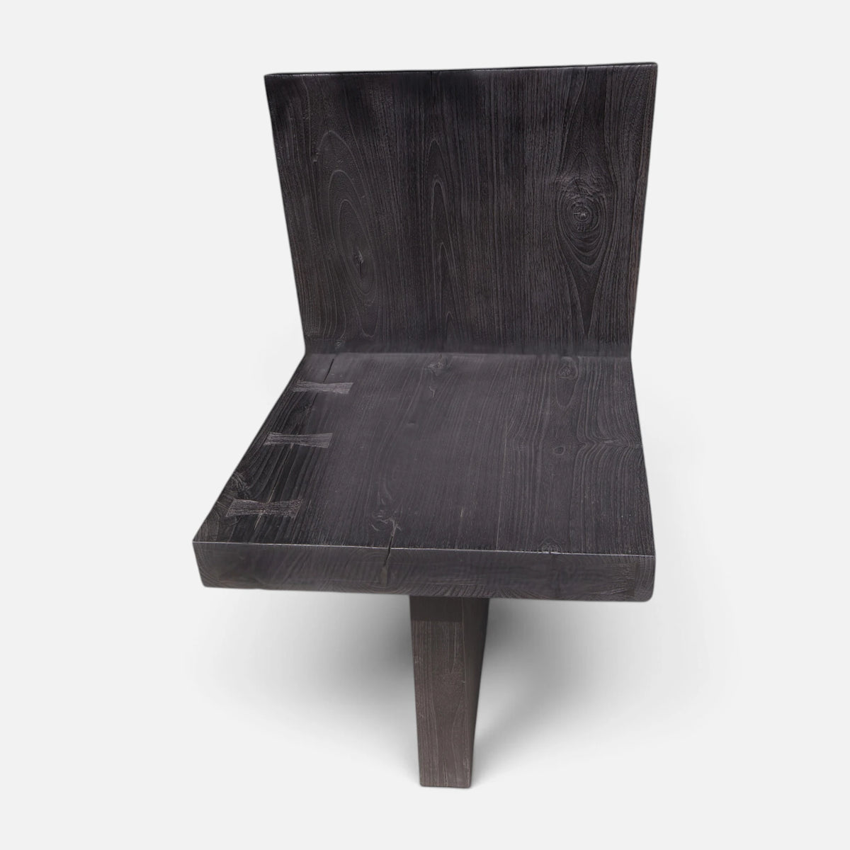 Front view of the Bespoke Butterfly Joint Fire-Charred Chair designed from solid teak wood planks highlighting the hand-chiseled joinery from Senja Living.