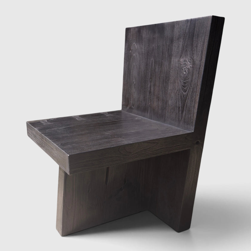 Side profile view of the Bespoke Butterfly Joint Fire-Charred Chair designed from premium teak wood planks highlighting its bold geometric brutalist form from Senja Living.