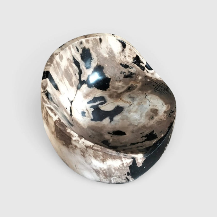 Top-down view of the Black and White Crystalline Petrified Wood Accent Chair looking straight into the polished scoop seat and natural crystalline patterns from Senja Living.