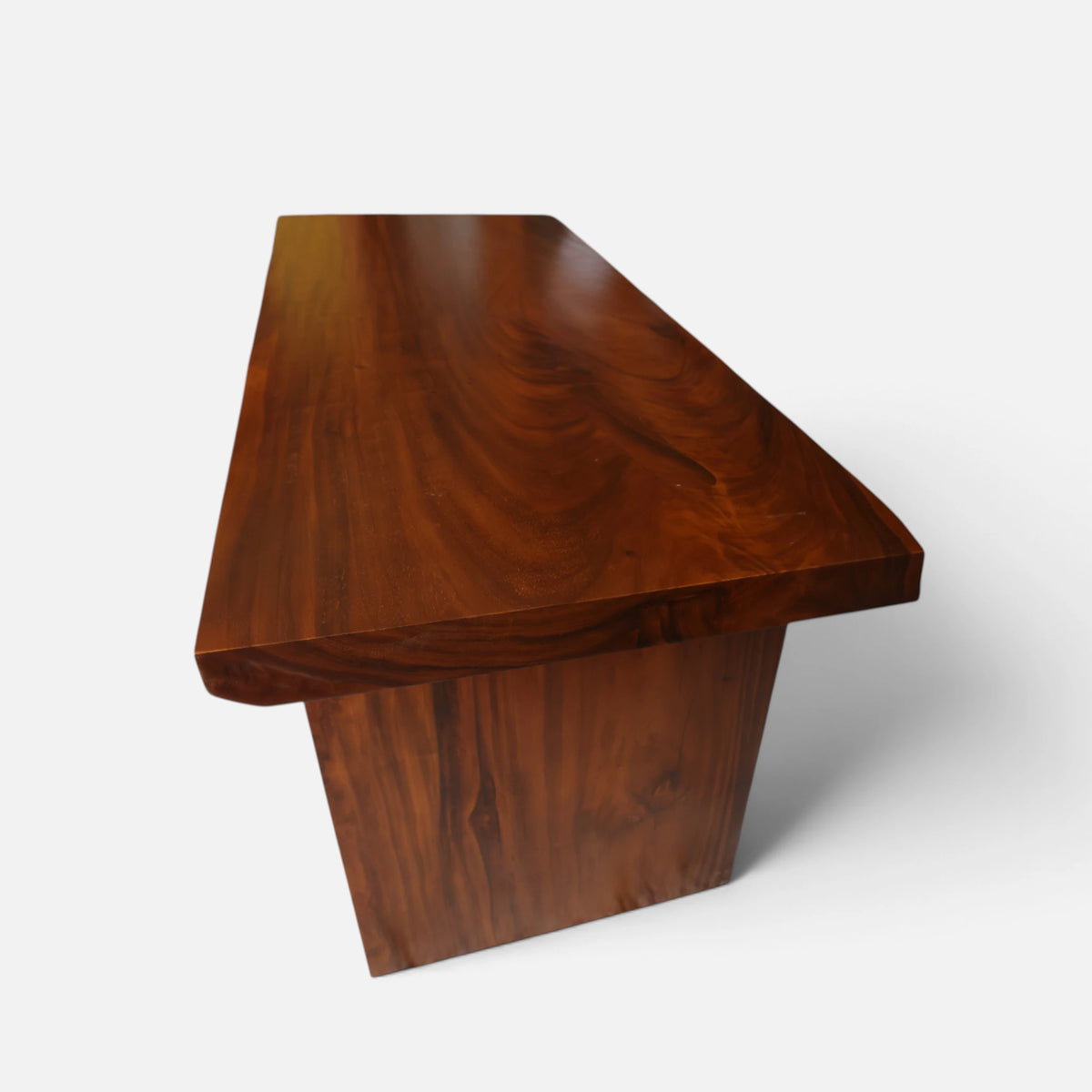 End-profile of the dual-edge table top of the Modern Organic Home Library Writing Table by Senja Living, highlighting the continuous wood grain flow across the solid tapered panel leg.