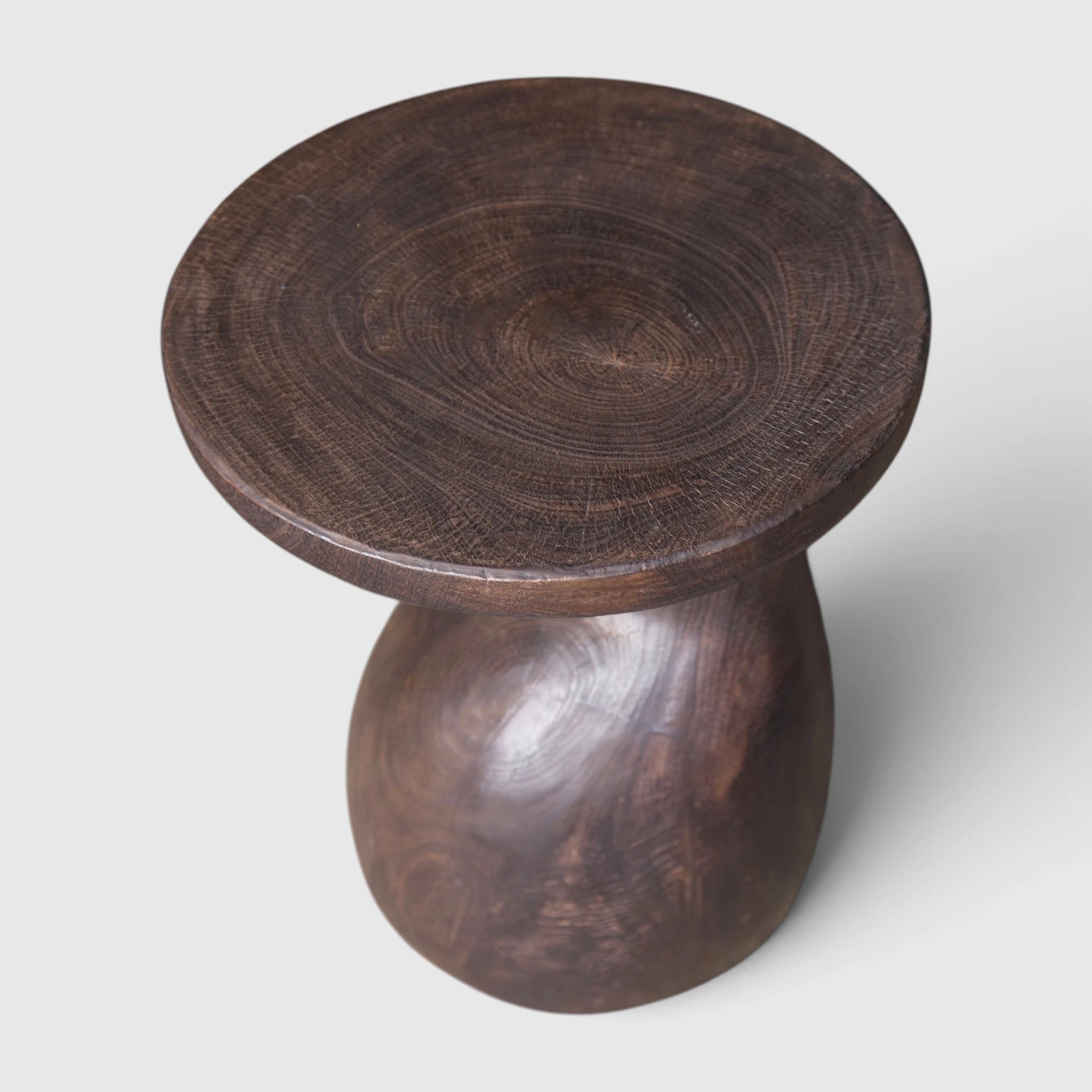 Sculptural Gooseneck Espresso Side Table made with mango wood, fire-torched with a natural polish,  from Senja Living.