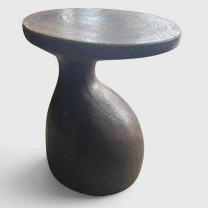 Sculptural Gooseneck Espresso Side Table hand-sculpted from a single solid block of mango wood showcasing fluid asymmetrical contours from Senja Living.