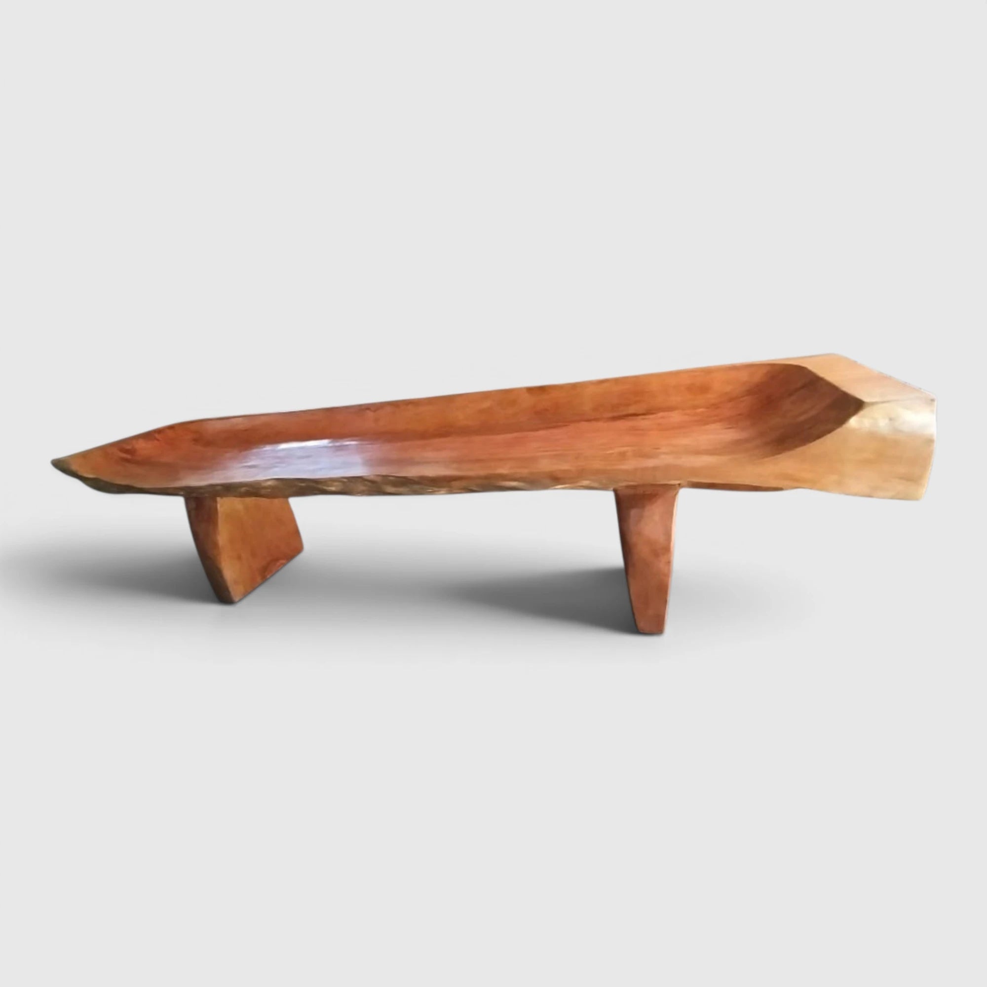 Sculptural Lychee Wood Live Edge Bench by Senja Living featuring a scooped, exquisitely polished seat and solid slab legs.