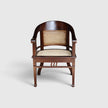 Front view of the Colonial Art Deco Teak Tub Back Armchair by Senja Living, featuring hand-woven cane paneling.