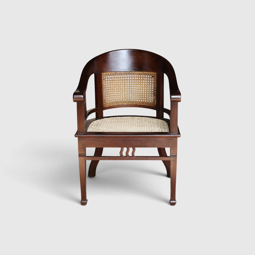 Front view of the Colonial Art Deco Teak Tub Back Armchair by Senja Living, featuring hand-woven cane paneling.