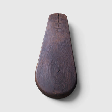 Overhead studio shot of the solid mango wood console table highlighting the rich organic grain patterns, rounded tabletop edges, and hand-keyed butterfly joints.