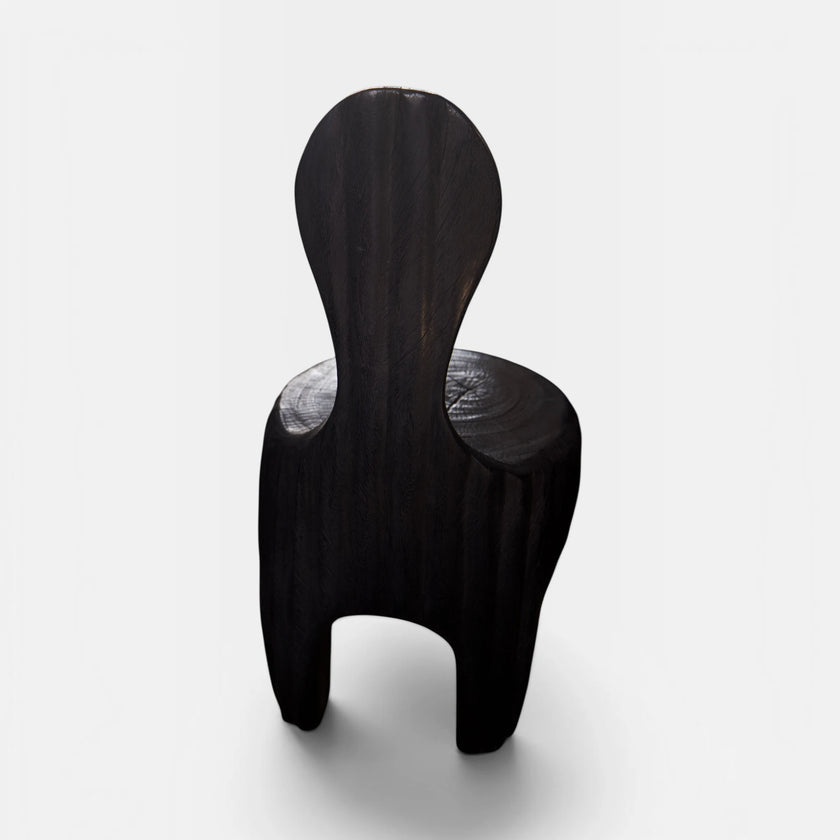 The Senja Living Bespoke Spoon-Back Chair is hand-sculpted from solid mango wood and is as commanding from the back as it is from the front.