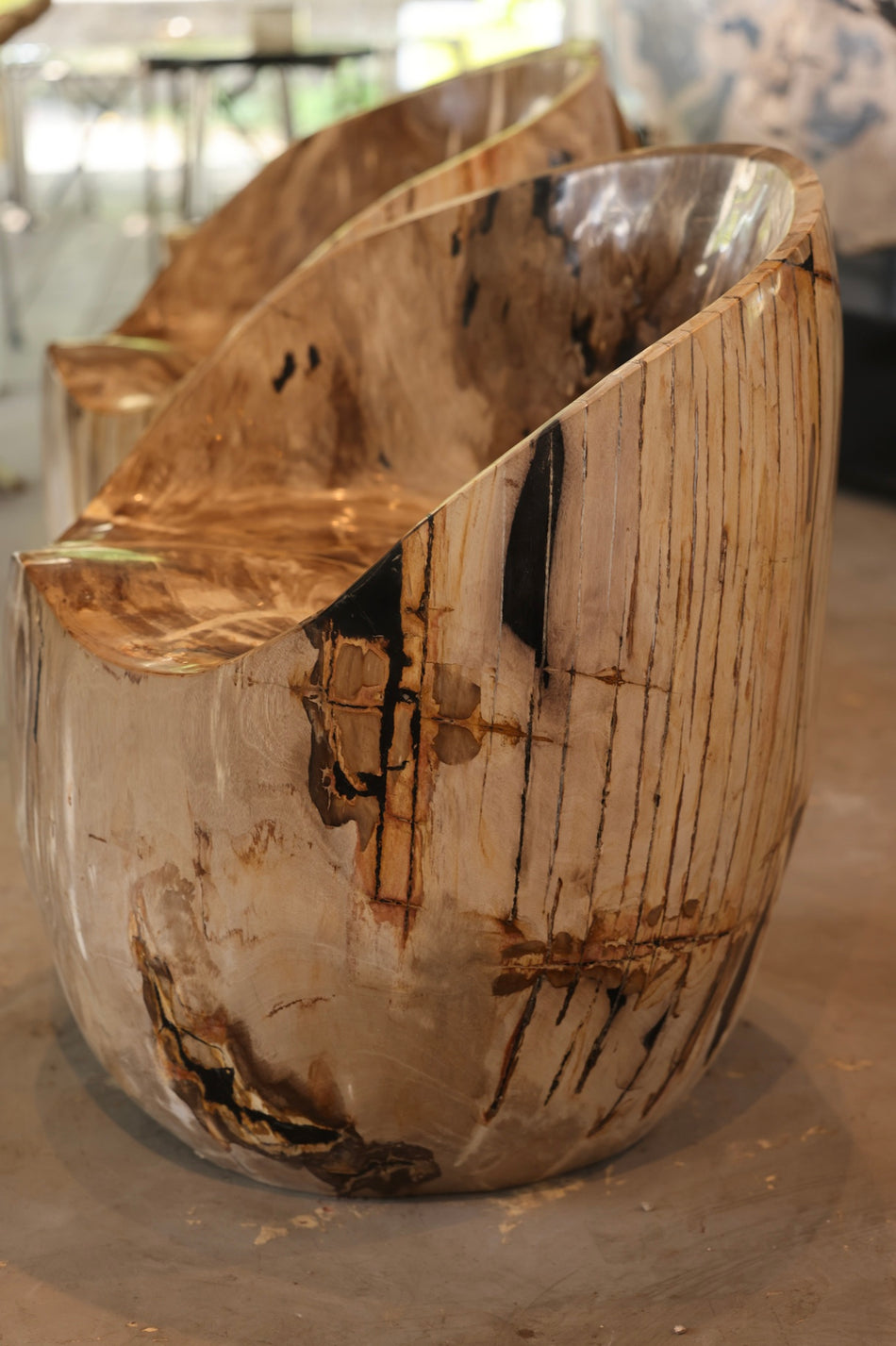 Bespoke modern organic statement furniture: Honey Amber Petrified Wood Accent Chair by Senja Living.
