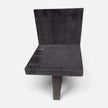 Direct front view of the Minimalist Brutalist Teak Fire-Charred Chair by Senja Living, highlighting the single center base leg, beautiful natural grains and aligned butterfly joints.