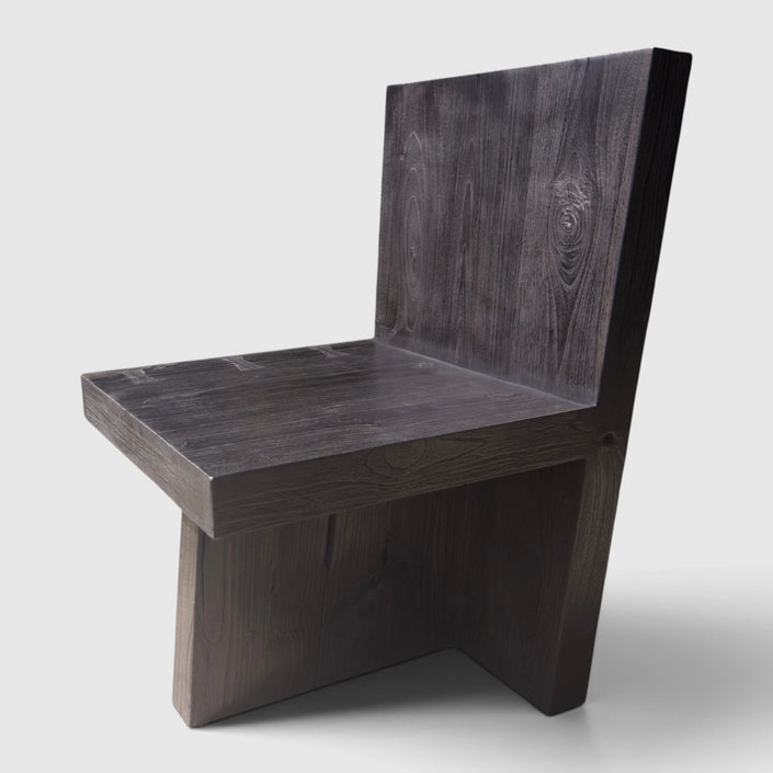 Three-quarter hero view of the Minimalist Brutalist Teak Fire-Charred Chair by Senja Living, highlighting its bold geometric block form.
