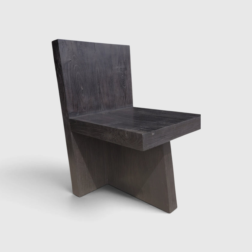 Alternative three-quarter view of the Minimalist Brutalist Teak Fire-Charred Chair by Senja Living showcasing the interlocking base structural geometry.