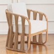  Studio-made Senja Ropes Attached Accent Chair highlighting the sweeping double-pole rattan frame and vertical weave rope detailing in a classic strings attached lounge chair style.